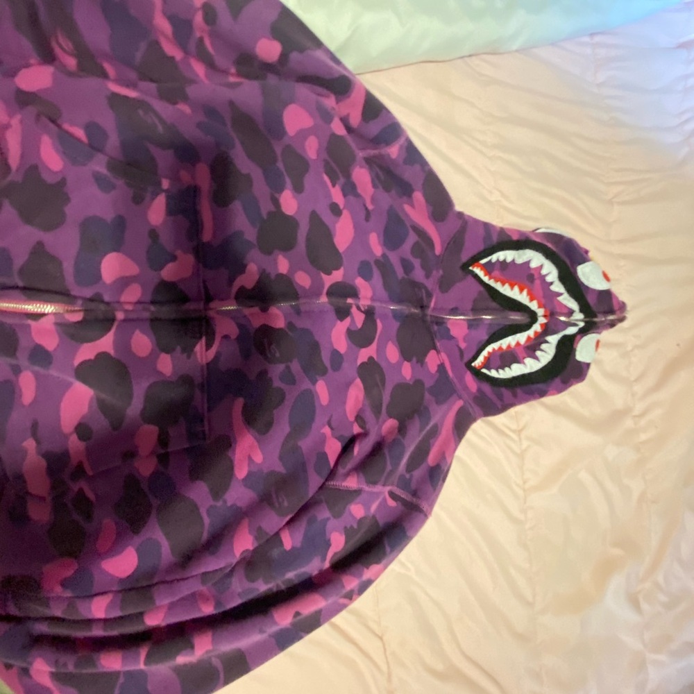 I am selling this Bape Zip up jacket hoodie. It is a size medium in women’s.